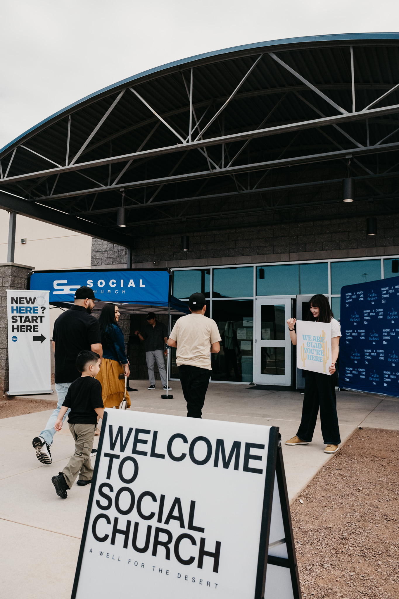 The Social Church welcome team greeting guests outside the entrance.